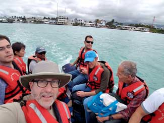 Shipmates in dingy on water