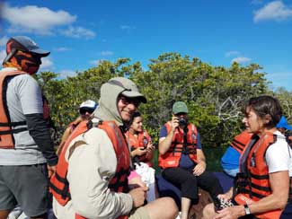 Shipmates in dingy on water