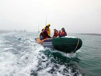 Shipmates in dingy on water